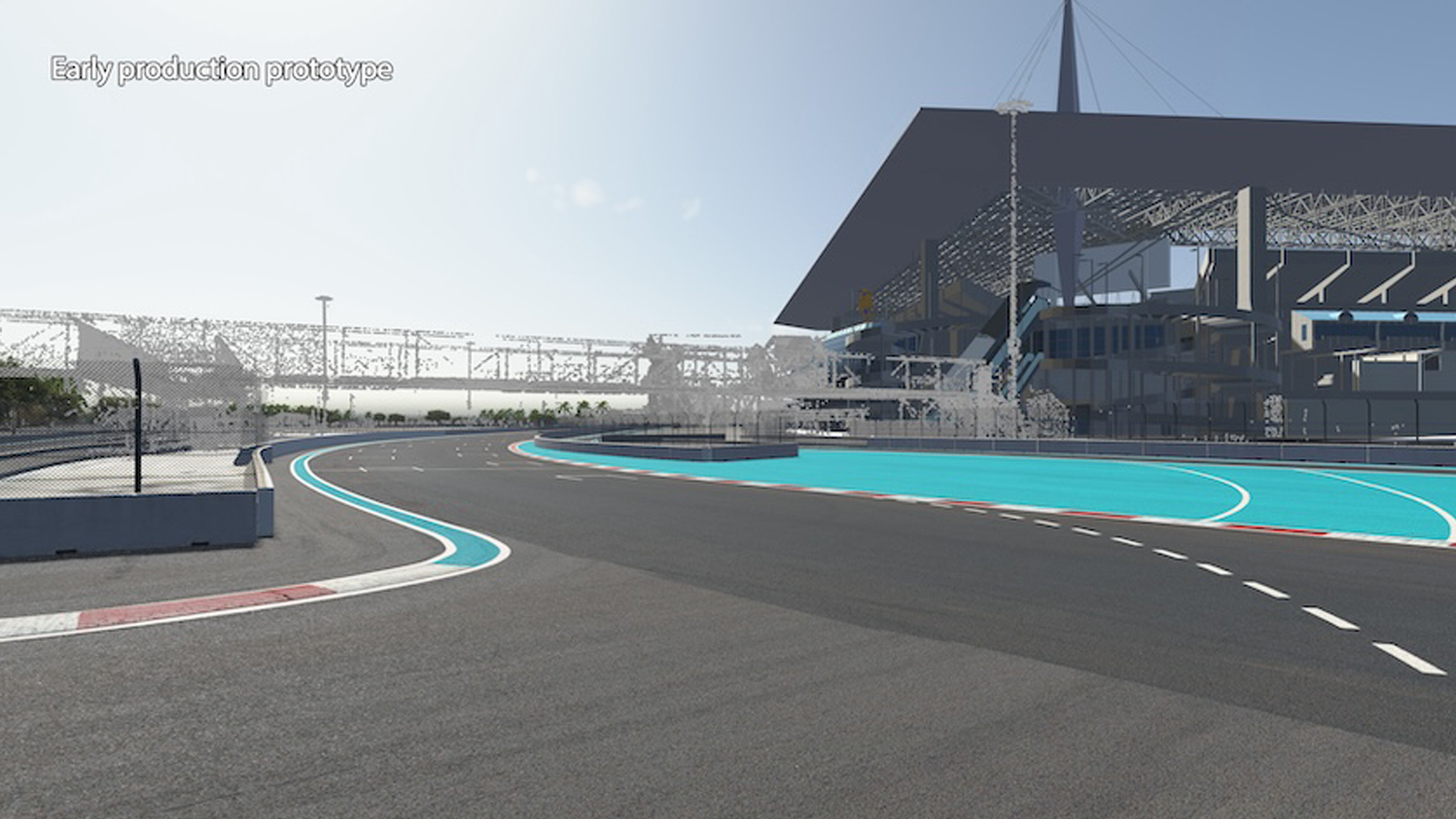 Image of a race track with dotted white lines, colored lines of blue, white, and red, and a solid pavemenet gray color 