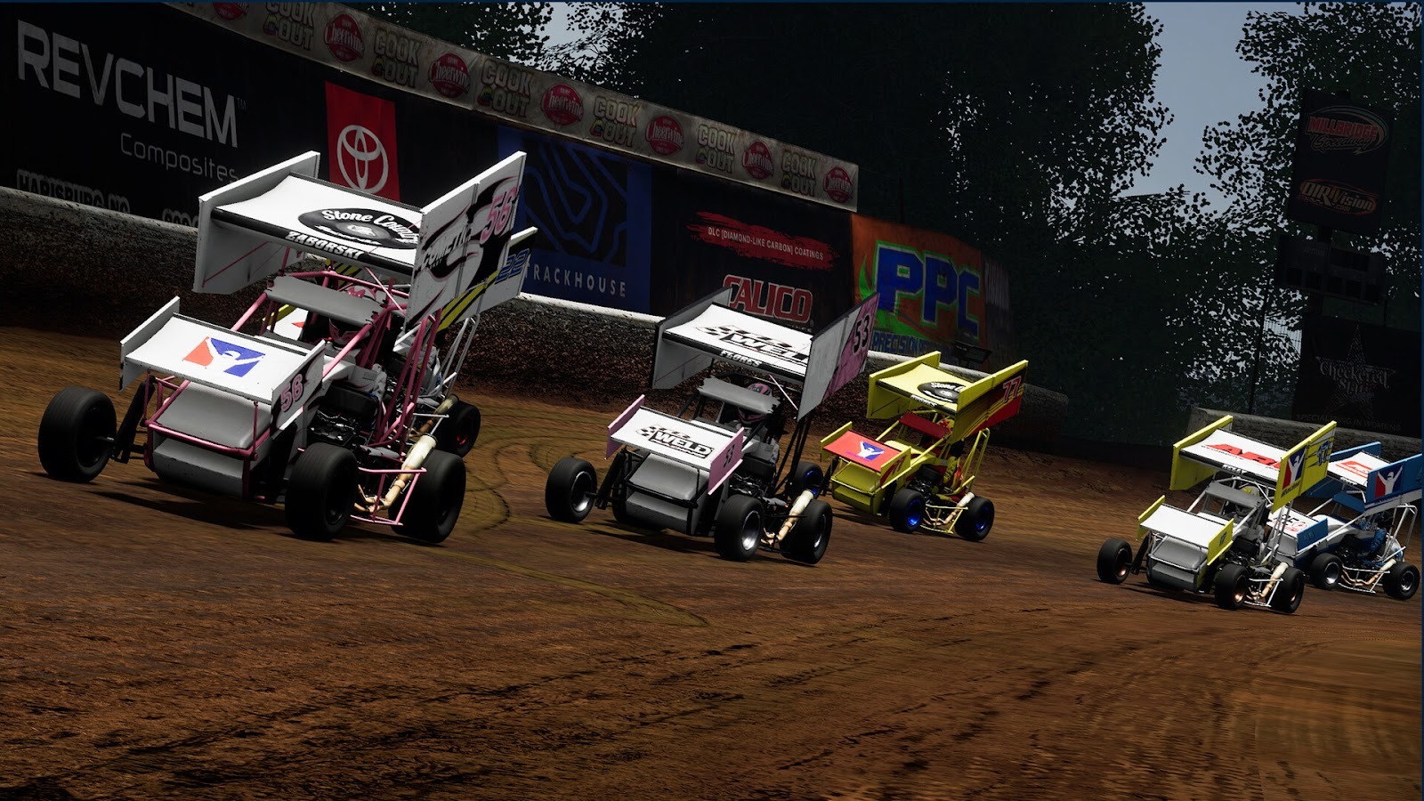 Five carts racing around dirt track
